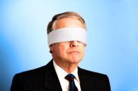 A man with a blindfold on his head.