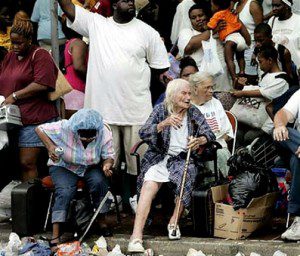 A group of people sitting on the ground.