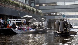 A boat with fans on the side of it