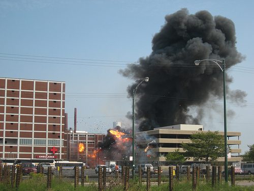 Black Smoke coming out of a building on fire.
